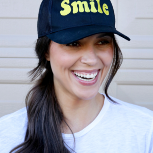 smile trucker hat in black and yellow